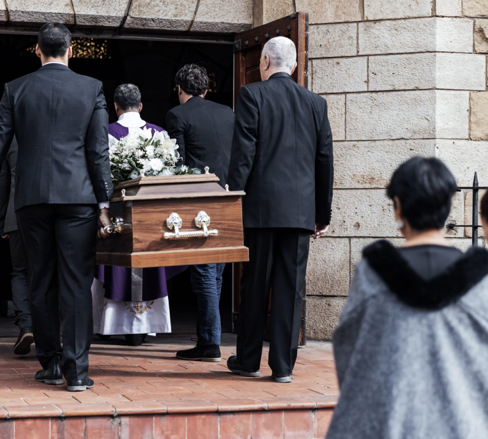 Death, funeral and people with coffin to church, chapel service and ceremony for temple ritual. RIP.